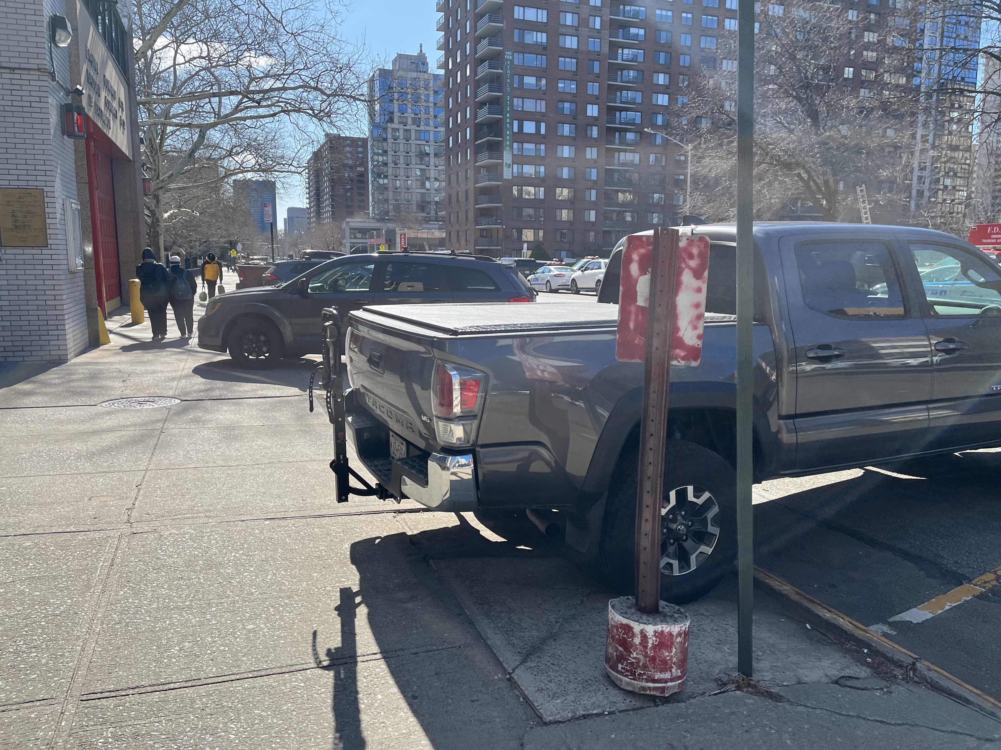 Personal cars on the sidewalk at the 24th. This is in front of the firehouse part of the installation, so perhaps they belong to the Bravest.